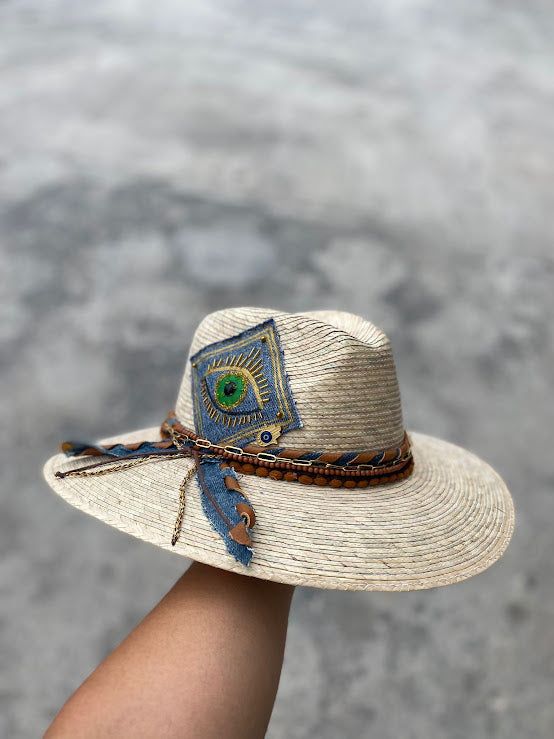 Unique palm hat embroidered by mexican artisans. Handmade of straw and beautifully embroidered by artisans in Mexico these hats are a must have if you want to stand of from the rest. They have an elastic band inside at the rim that makes them very comfortable and be worn from small to medium sizes. Dimensions: Small to Medium (54-55 cm *21 inches approx.) - (56-57 cm *22 inches approx.) Personalized Hats are made to order, allow 5 days to deliver. Handmade Toquilla Straw Fedora With Curved Brim, Handmade Toquilla Straw Panama Hat With Curved Brim, Handmade Fedora Panama Hat In Toquilla Straw, Handmade Toquilla Straw Fedora With Short Brim, Adjustable Palm Leaf Fedora Hat, Bohemian Palm Leaf Hat Bands For Vacation, Bohemian Palm Leaf Hat Bands For Summer, Handmade Natural Toquilla Straw Fedora, Embroidered Straw Hat For Beach With Short Brim