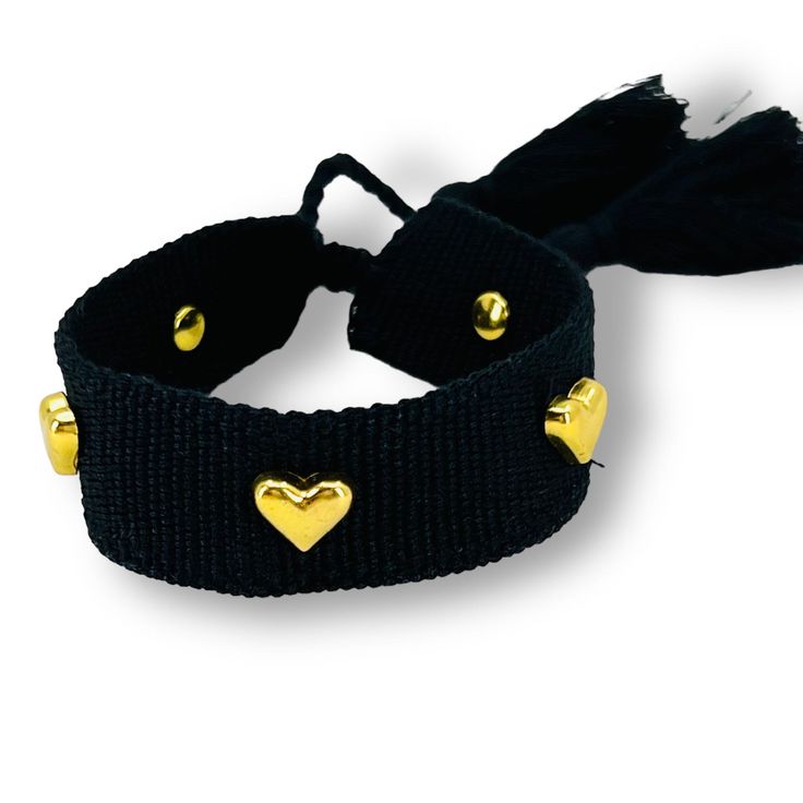 This adorable Hearts Bracelet is perfect to wear alone or combined with other bracelets. This is an adjustable bracelet so it is ideal for all ages and wrist sizes. - Gold Plated Heart Charm - Cotton - Adjustable For All Sizes Listing is for 1 Hearts Bracelet only. Adjustable Wristband For Friendship, Heart Charm Bangle Bracelets For Friendship, Adjustable Heart Charm Bangle Bracelet, Adjustable Heart Charm Bracelet Gift, Adjustable Heart Charm Bracelet As Gift, Adjustable Heart Charm Bracelet For Gift, Adjustable Heart-shaped Charm Bracelet Gift, Adjustable Jewelry With Heart Charm For Gifts, Friendship Bracelets With Double Heart Charm