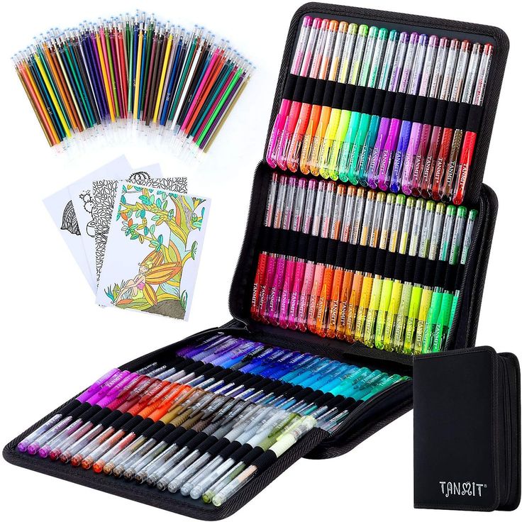 a large case filled with lots of colored crayons next to an open notebook