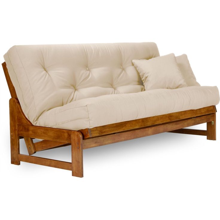 a futon sofa with two pillows on it's back and one arm extended