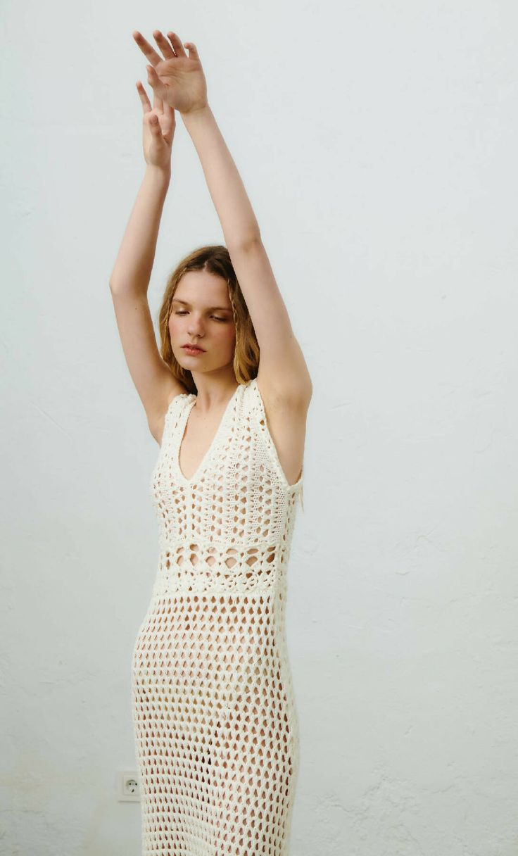 Hand crochet dress made by local artisans from organic cotton yarn. Amazing craftsmanship with attention to details makes this dress a statement piece for the warm summer days. Open knit structure with sheer effect and flattering body fit makes this dress a favorite piece in woman's wardrobe. Hand wash only. White Open Knit Crochet Dress For Spring, White Crochet Beachwear Dress, White Summer Crochet Dress With Open Knit, Chic Sleeveless Cotton Crochet Dress, White Open Knit Summer Crochet Dress, White Open Knit Crochet Mini Dress, White Open Knit Crochet Dress For Summer, Elegant Summer Crochet Dress In Cotton, Pointelle Knit Vacation Dress