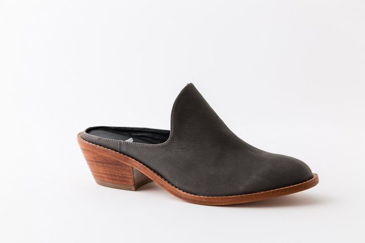 Classic Mules With Contrasting Heel Counter, Leather Mules With Wrapped Low Heel, Chic Leather Sole Almond Toe Mules, Classic Almond Toe Mules With Contrasting Heel Counter, Low Heel Mules With Stacked Heel For Work, Leather Mules With Wooden Low Heel, Leather Mules With Wrapped Heel, Low Heel Mules With Wooden Heel For Workwear, Chic Almond Toe Mules With Leather Sole