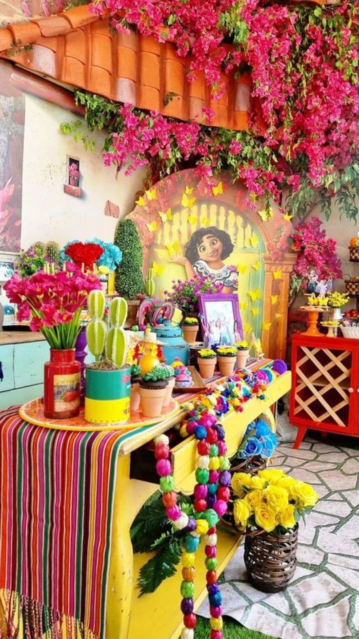 a table with flowers and decorations on it