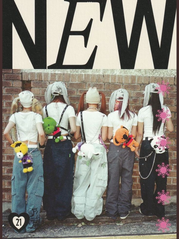 there are four people dressed in costumes standing next to a brick wall with the word news on it