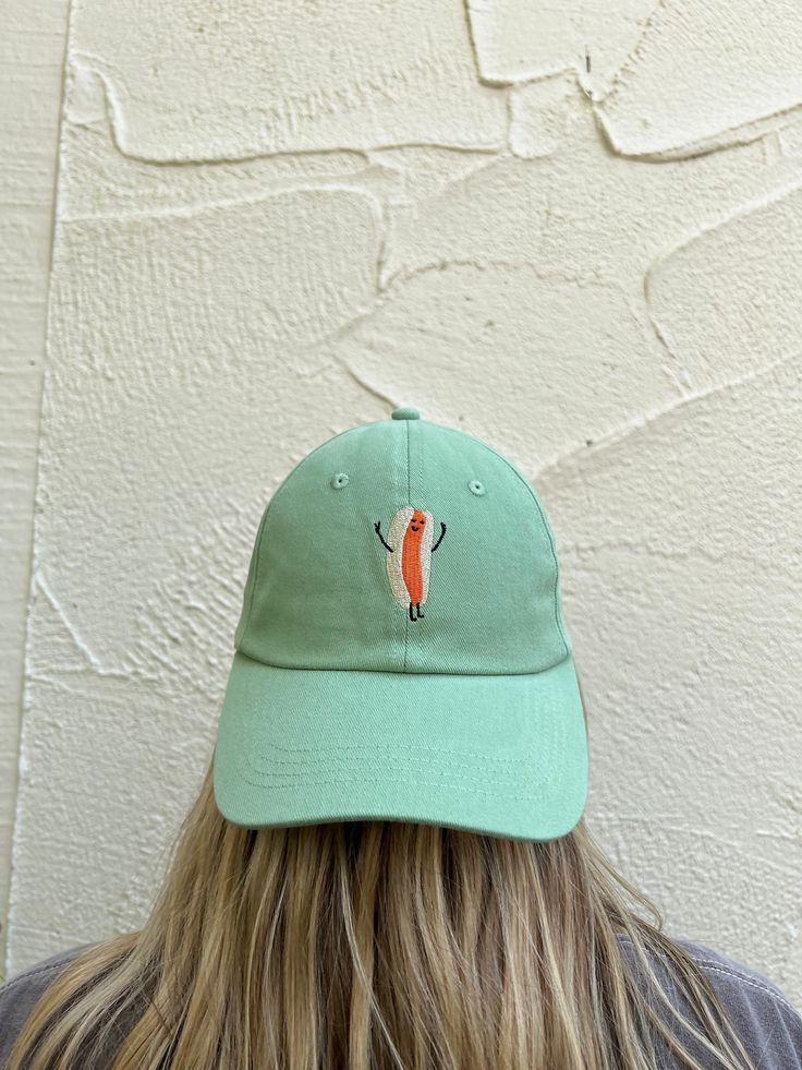 "The Charles" Cotton hat is a 6-panel hot dog dad hat with an adjustable brass clasp closure with a direct embroidery logo. Crown: 100% Cotton fabric Visor: 100% Cotton fabric 6-panel Adjustable Brass clasp hat Chain stitch embroidery Green Cotton Dad Hat With Flat Bill, Green Cotton Flat Bill Hats, Fun Cap With Embroidered Logo, Fun Embroidered Logo Baseball Cap, Fun Baseball Cap With Embroidered Logo, Fun Adjustable Cotton Dad Hat, Fun Embroidered Logo Cap, Adjustable Curved Brim Fun Dad Hat, Fun Adjustable Dad Hat