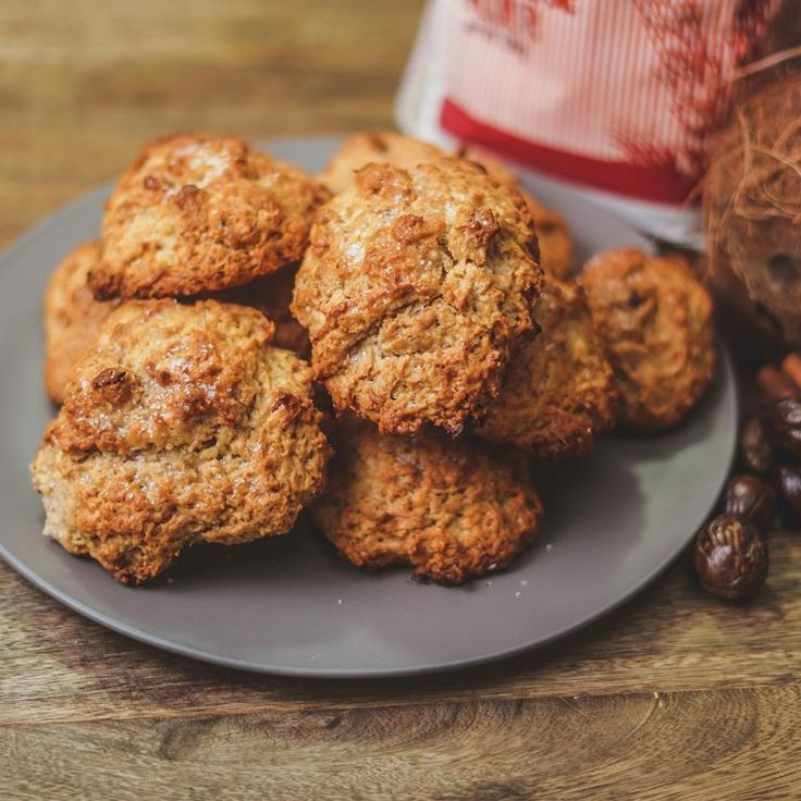 a plate full of cookies next to some nuts