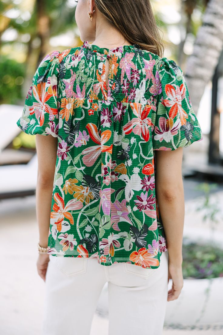 We hope you have all the plans for this blouse! It's sure to take you from the office to the beach side restaurant! That tropical floral print is so fun and colorful! Round neckline Smocked yoke Button keyhole back Short bubble sleeves Tropical floral print No stretch Savannah is wearing the small. Vacation Tops With Smocked Bodice And Short Sleeves, V-neck Blouse With Smocked Bodice For Vacation, Multicolor Smocked Top For Beach In Summer, Multicolor Smocked Top For Beach Summer, Multicolor Smocked Top For Beach And Summer, Vacation Smocked Top With Short Sleeves, Vacation Smocked Bodice Short Sleeve Blouse, Vacation Blouse With Smocked Back And Short Sleeves, Short Sleeve Blouse With Smocked Back For Vacation