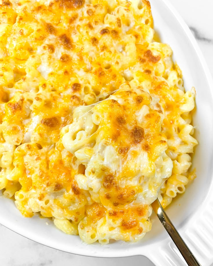 a white plate topped with macaroni and cheese