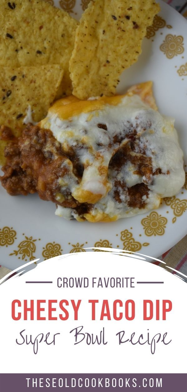 cheesey taco dip on a plate with tortilla chips