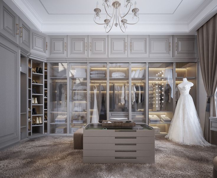 a wedding dress is on display in a walk - in closet with chandelier