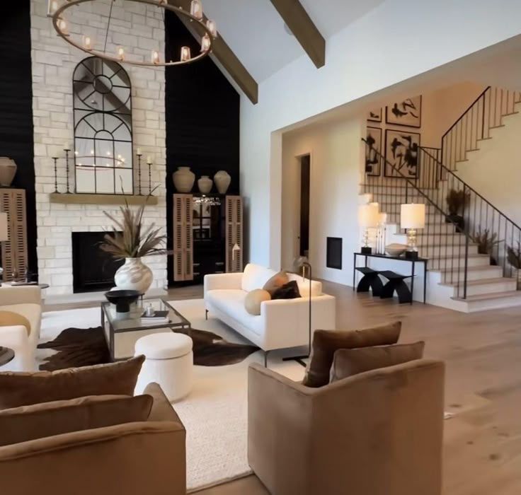 a living room filled with lots of furniture and a fire place in the middle of it