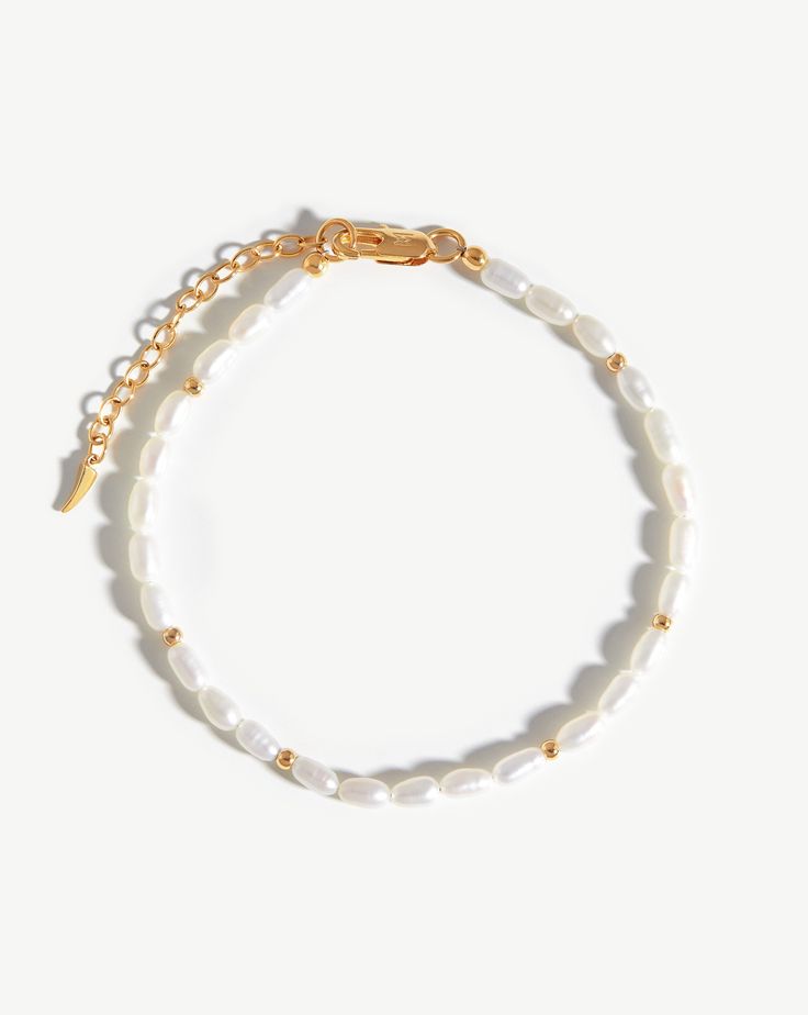 Seed Pearl Beaded Anklet 18ct Gold Plated/Pearl. Inspired by Natural Forms. Bringing Wisdom and Knowledge, Freshwater Seed Pearls Form this Unique Anklet, Contrasted and Offset with Small Gold Beads for a Distinctive Finish. The Ultimate Way to Upgrade Your Ankle Game. Elegant Pearl Anklets With Pearl Chain, Elegant Pearl Chain Anklets, Pearl Bracelet With Gold Beads And Round Beads, Elegant Pearl Beaded Anklets, Gold Pearl Anklet With Pearl Charm, Elegant Pearl Bracelet With Polished Beads, Elegant White Anklets With Pearl Chain, Elegant White Pearl Chain Anklets, Elegant Polished Pearl Bracelet