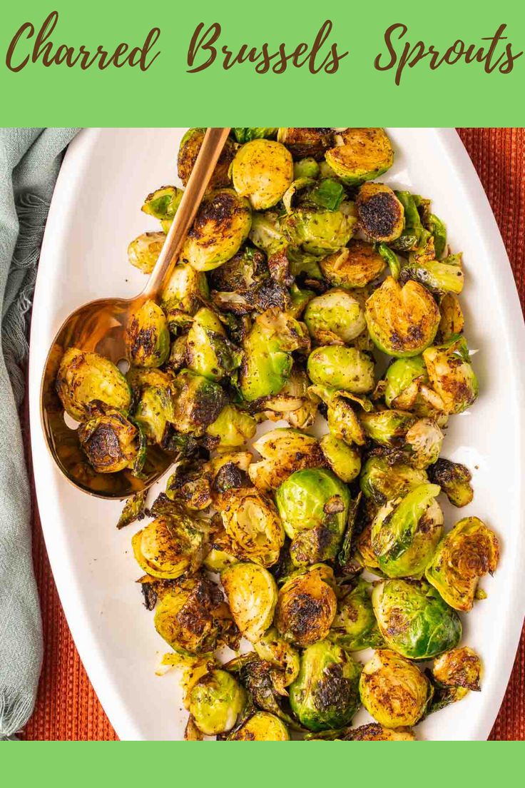 roasted brussel sprouts on a white plate with chopsticks