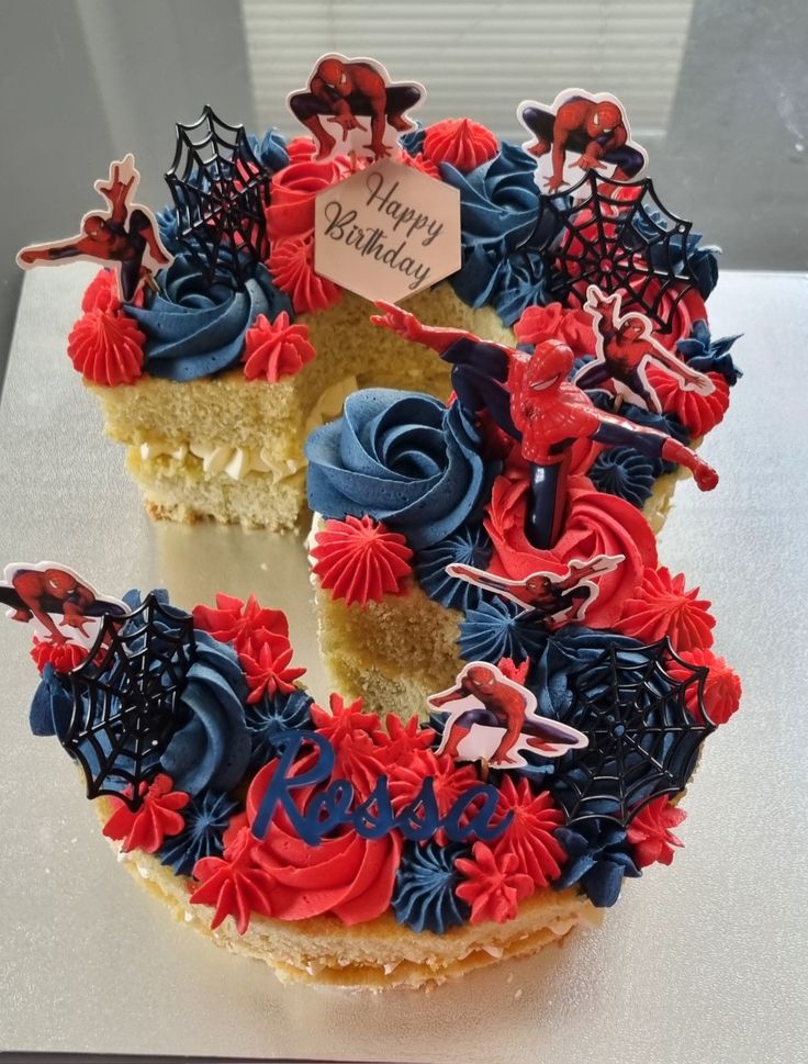 a birthday cake decorated with red, white and blue icing