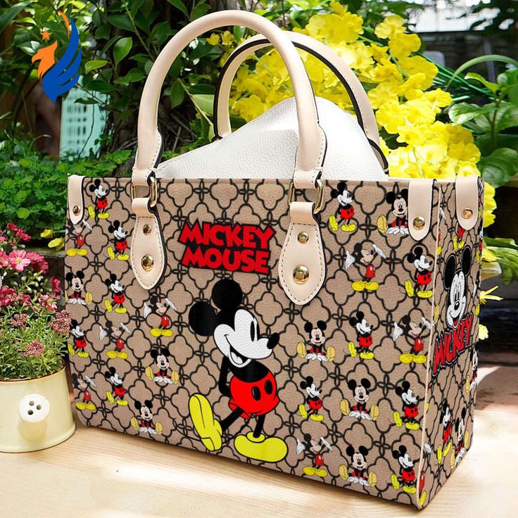 Introducing the Mickey Mouse Leather Handbag Gift for Women – the perfect blend of style, functionality, and Disney magic! Crafted with premium leather, this handbag showcases a timeless design adorned with a charming Mickey Mouse motif, adding a touch of whimsy to any outfit. With a spacious interior and multiple compartments, it offers ample storage for all your essentials, keeping you organized on the go. The adjustable shoulder strap ensures a comfortable fit, while the sturdy construc Mickey Mouse Purse, Custom Leather Bag, Mickey Mouse Bag, Disney Purse, Disney Bag, Vintage Mickey, Timeless Accessories, Personalize Bag, Small Handbags