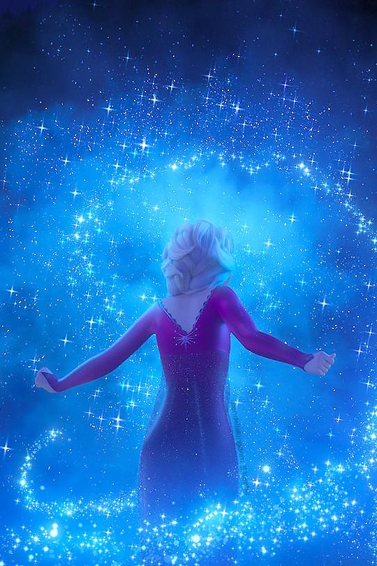 a woman standing in the middle of a blue circle with stars around her and arms outstretched