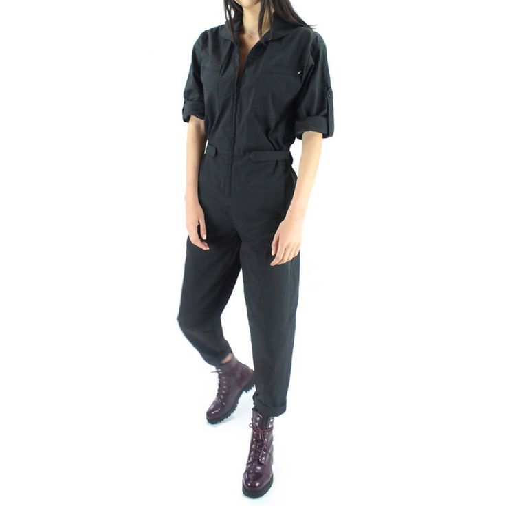 100% Nylon - Black. Instantly ready for anything. Black Fitted Suits For Spring, Black Suit For Fall Workwear, Black Relaxed Fit Jumpsuit For Workwear, Casual Fitted Solid Suits, Black Utility Jumpsuit For Workwear, Chic Black Winter Suit, Chic Black Suits With Pockets, Fitted Black Suit For Fall, Casual Black Jumpsuits And Rompers For Office