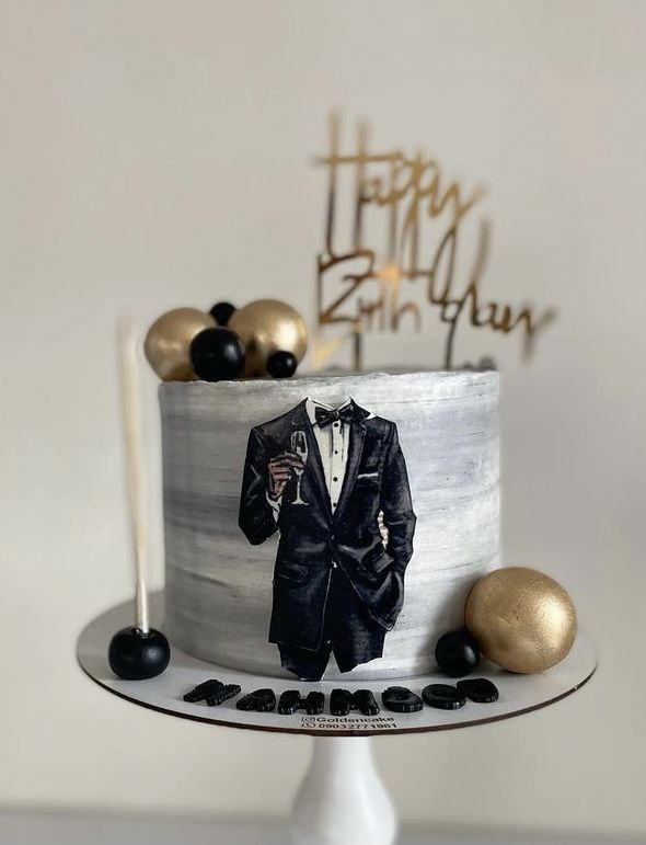 a birthday cake with an image of a man in a tuxedo on it