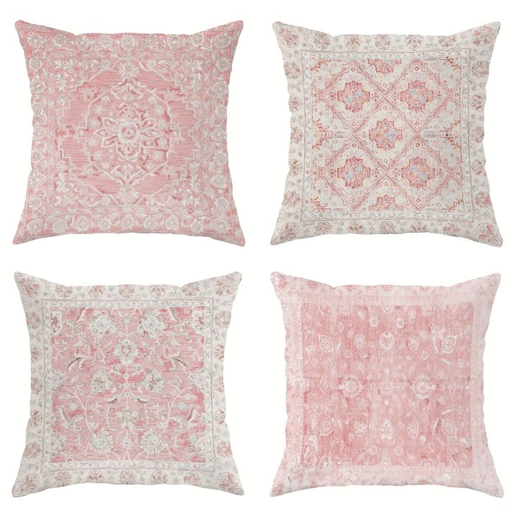 four pink and white pillows on a white background