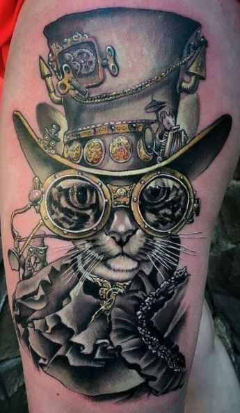 a cat with glasses and a top hat on it's head is shown in this tattoo