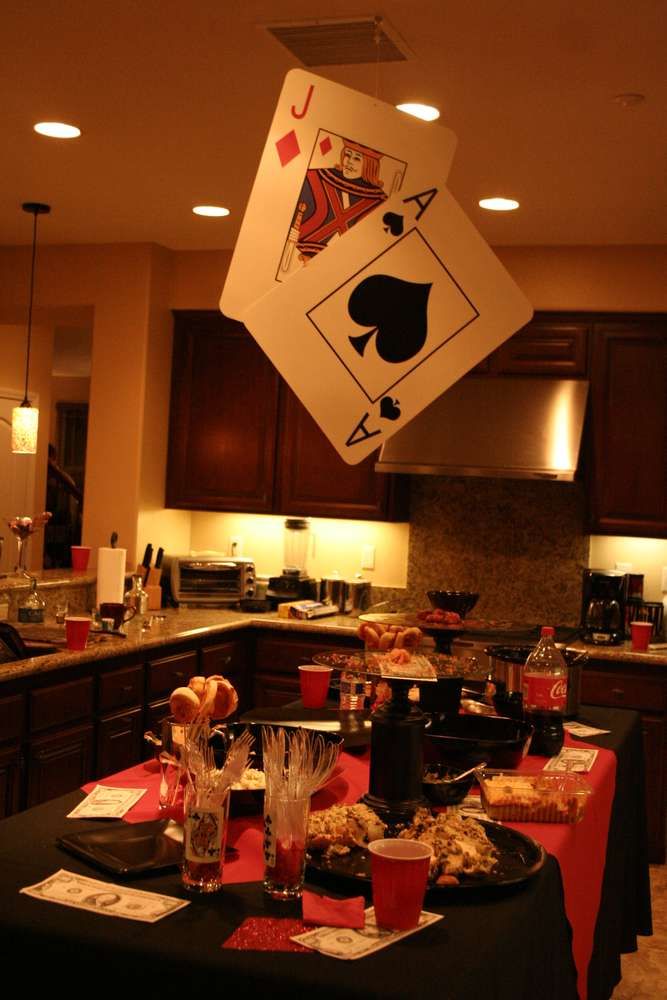 a casino themed party is set up in the kitchen for guests to eat and drink