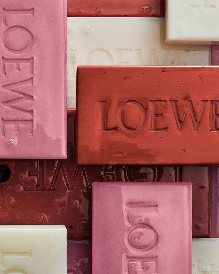 several different colored soaps with the word love on them