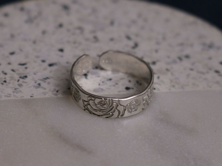 This June birth flower ring is perfect for everyday wear and features a detailed rose design, available in both silver and gold. Product Details: Materials: Sterling Silver or Gold Filled Color: Silver, Gold Size: 6mm You will receive one hand-stamped ring with no enamel filling. June Birth Flower, Stamped Ring, Hand Stamped Ring, Stamped Rings, Rose Ring, Birth Flower, Birth Flowers, Rose Design, Flower Ring