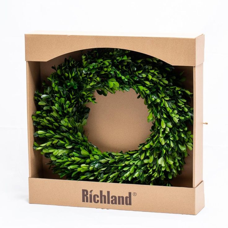 a box that has a wreath inside of it