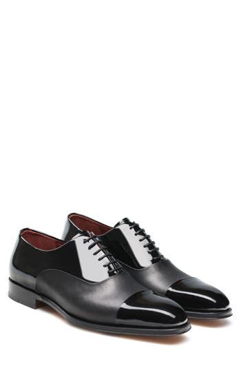 Panels of nappa and patent leathers define an updated formal shoe with a distinctive shine and stately silhouette. Removable insole Leather upper, lining and sole Made in Spain Men's Shoes Patent Leather Wingtip Shoes For Semi-formal, Patent Leather Wingtip Shoes For Semi-formal Occasions, Patent Leather Oxfords With Contrast Sole For Work, Business Leather Shoes With Pointed Toe And Contrast Sole, Classic Patent Leather Shoes With Contrast Sole, Designer Pointed Toe Oxfords For Business, Elegant Oxfords With Contrast Sole For Office, Elegant Wingtip Oxfords With Contrast Sole, Patent Leather Dress Shoes With Brogue Detailing For Work