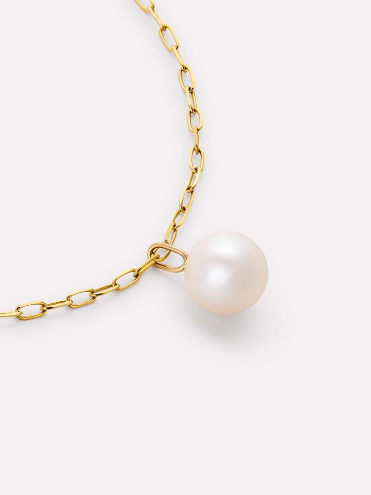 It doesn’t get more pearl-fect than this gold pendant. Crafted in solid gold, this set features a timeless paperclip chain and freshwater pearl charm. Perfect for the minimalist, this necklace set is both simple and chic. If you’re searching for more pearls, complete your look with our Gold Pearl Studs. The Gold Round Pearl Necklace includes two pieces: Gold Paperclip Chain Necklace - Gold Paperclip Necklace and Gold Pendant - Gold Round Pearl Charm. • Crafted in recycled solid gold • Made to last a lifetime • Set featuring one necklace & freshwater pearl charm Gold Paperclip Necklace, Gold Pendant Set, Paperclip Necklace, Paperclip Chain Necklace, Pearl Charms, Pendant Gold, Letter Necklace, Pearl Studs, Gold Pearl