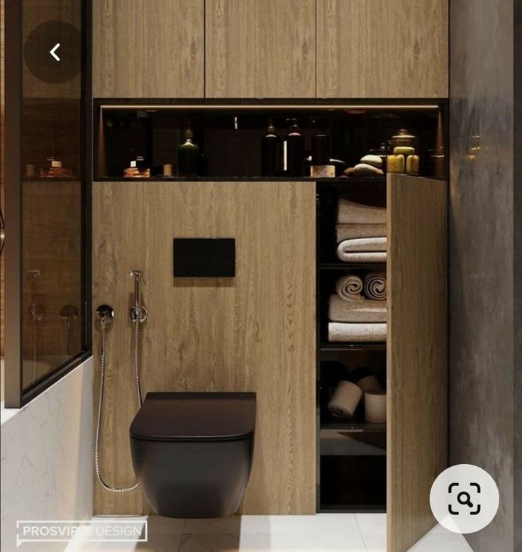 a bathroom with wooden cabinets and a toilet