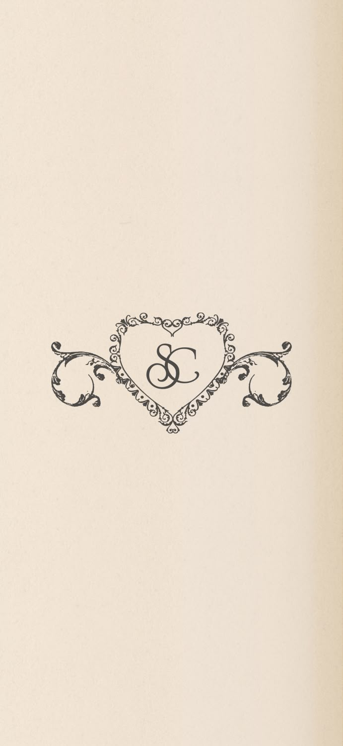 an ornate heart with the letter g on it's side is shown in black and white