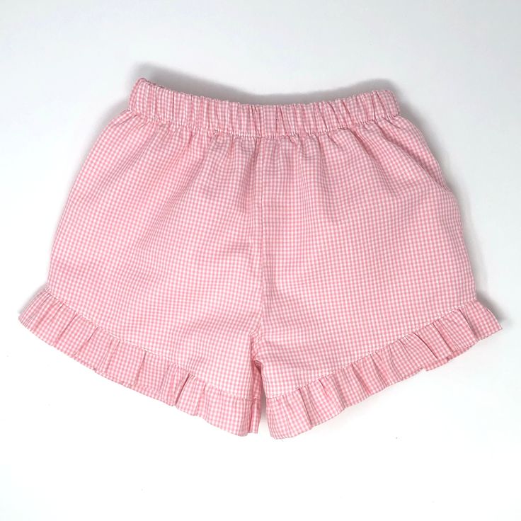 These made-to-order bottoms are a must-have for your any closet! The Amali Short in our signature ruffle hem style. Handmade in the United States. 100% cotton Lined Please note: this item is made to order, with love, in the United States. Please allow 3+ weeks business days for in-house production, as we cut orders in bulk. Casual Cotton Bloomers With Ruffles, Playful Pink Ruffled Shorts, Summer Cotton Bloomers With Elastic Waistband, Cotton Bloomers With Ruffles For Spring, Spring Cotton Bloomers With Ruffles, Casual Pink Cotton Bloomers, Cotton Bloomers With Ruffle Hem For Summer, Cute Cotton Bottoms For Summer, Cute Fitted Cotton Bottoms