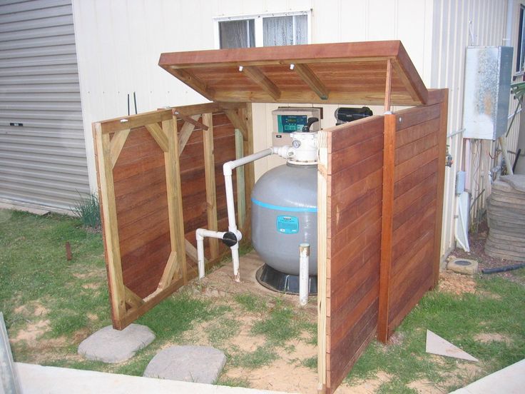 an outdoor storage shed with a water heater in it