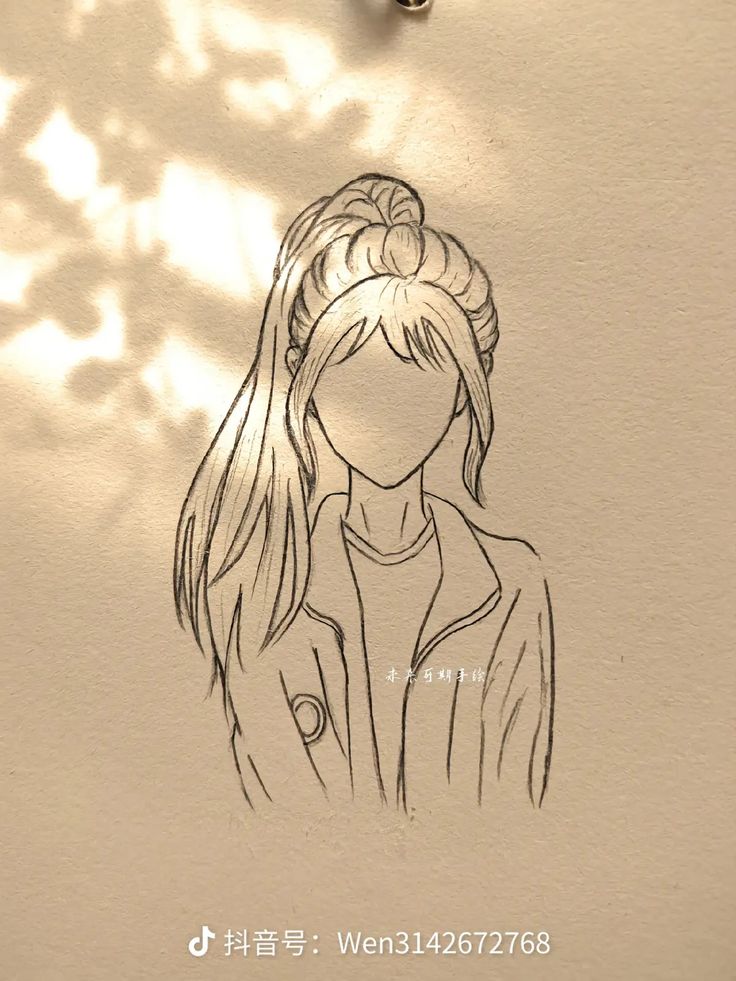 a drawing of a woman's head is shown on a piece of white paper