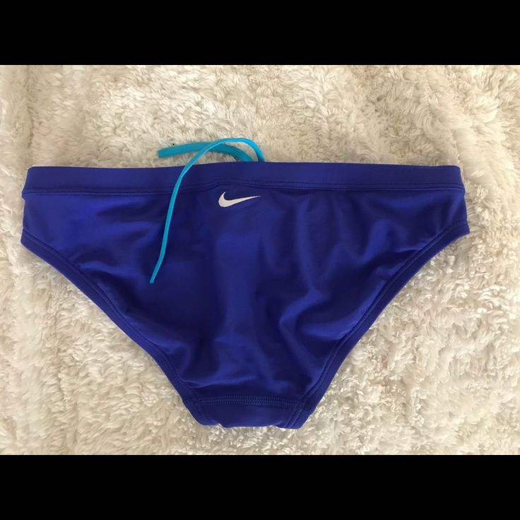 Never Worn. New With No Tag Nike Sporty Bottoms For Poolside, Nike Bottoms For Poolside And Beach Season, Blue Swim Trunks For Water Polo, Blue Briefs For Water Polo, Sporty Blue Brief Swim Trunks, Sporty Blue Swimwear For Beach Season, Blue Brief Swim Trunks, Nike Sporty Swim Trunks For Swimming, Blue Stretch Swim Trunks