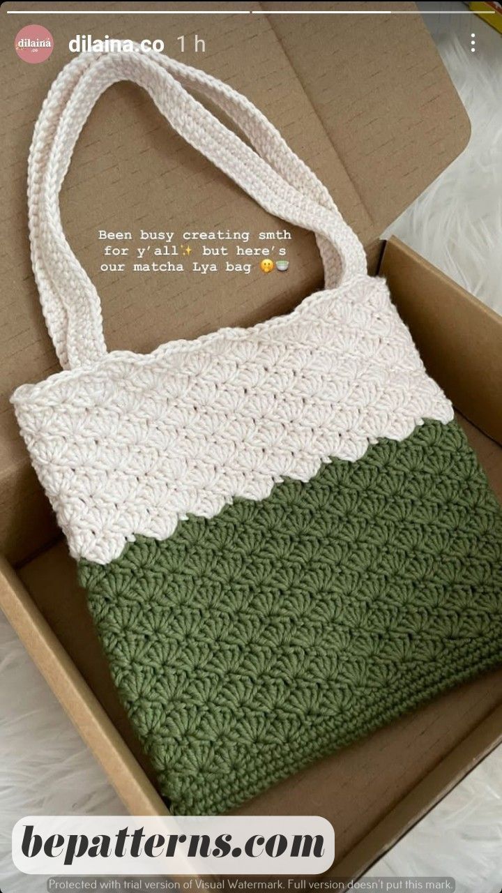 a crocheted bag sitting in a box