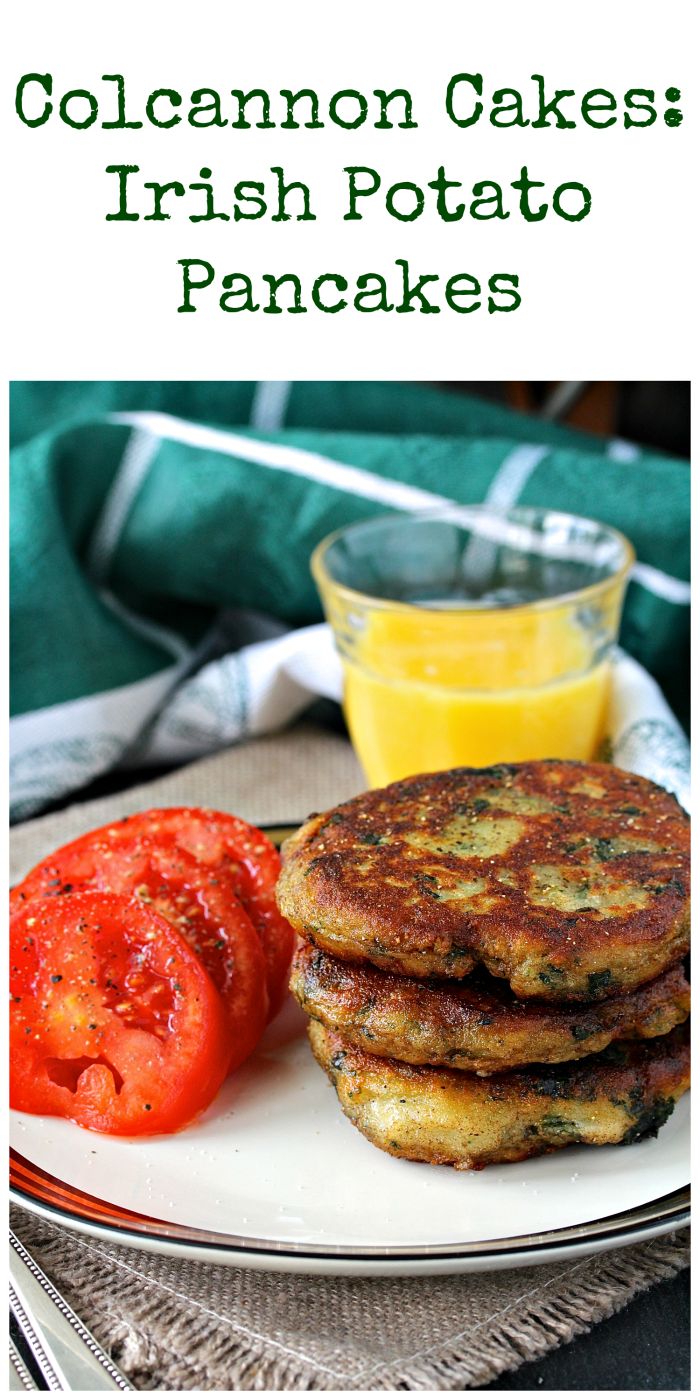 a white plate topped with pancakes and tomatoes