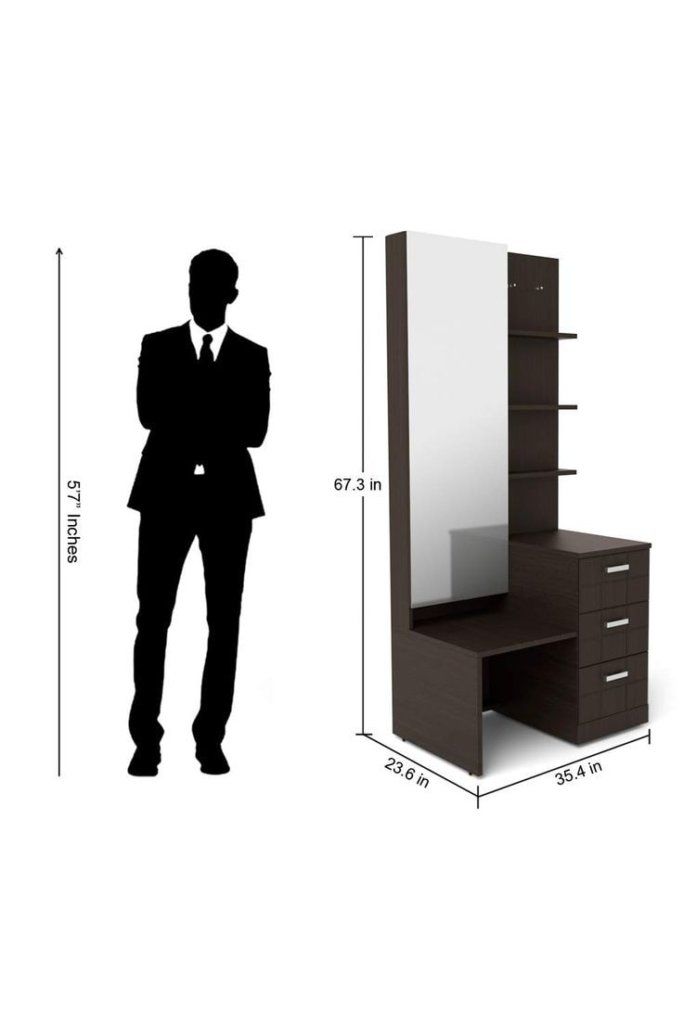 the silhouette of a man in a suit is next to a dresser with a mirror