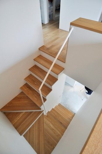 there is a wooden stair case in the house