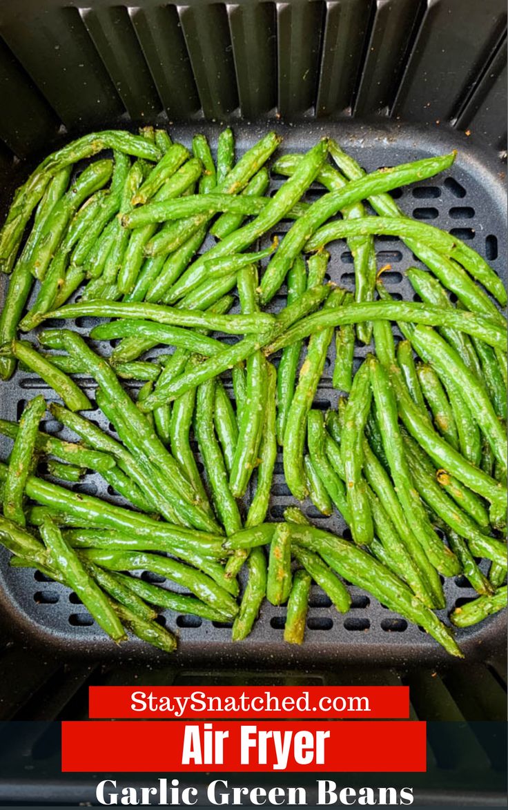 air fryer filled with green beans on top of a grill