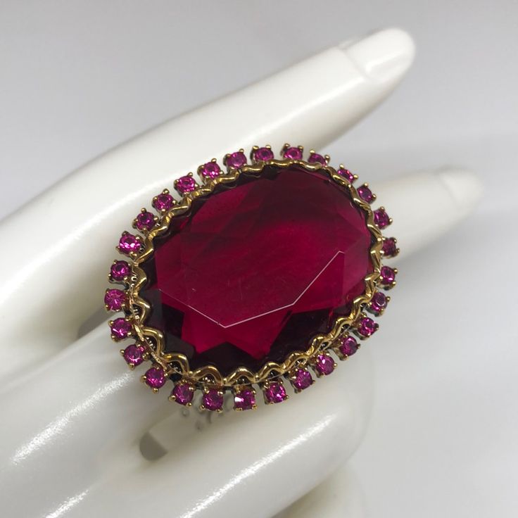 Badgley Mischka Ring With Massive Stone Surrounded By Fuchsia Crystals . If You Are Searching For A Statement Ring - This Is The One . Comes With A Tag Attached . Never Worn . In Very Good Condition . Ruby Party Ring, Glamorous Rhinestone Formal Rings, Glamorous Formal Rings With Rhinestones, Pink Rings With Sparkling Stones For Formal Events, Pink Gemstone Party Ring, Oval Ruby Ring For Party, Oval Ruby Ring For Parties, Party Ruby Gemstone Rings, Elegant Faceted Ruby Ring For Formal Occasions