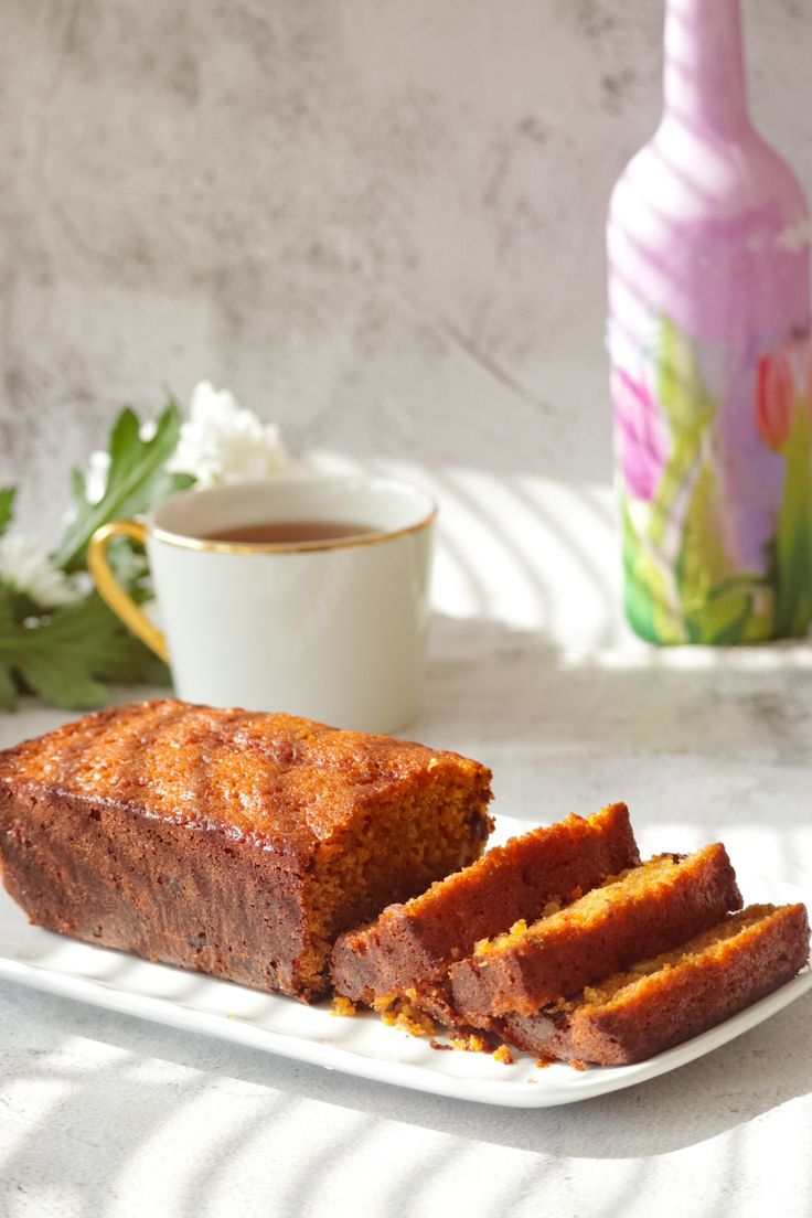 a loaf of cake sitting on top of a white plate