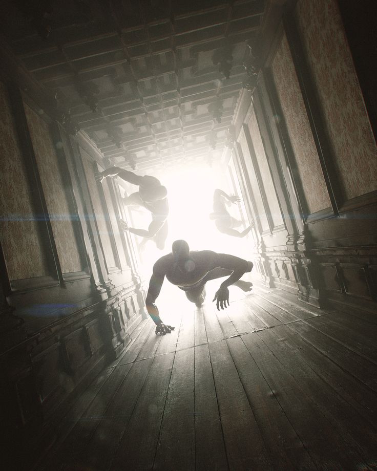 three people are doing tricks in the middle of a room with light coming through them