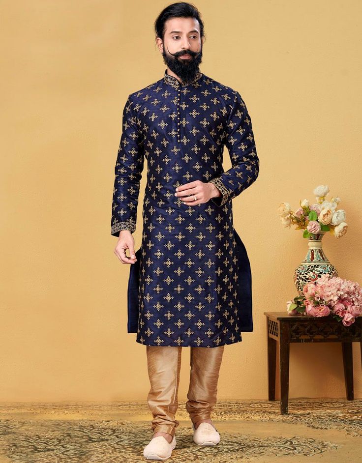 Navy Blue Kurta Dhupion Embroidered Silk Churidar Navy Blue Embroidered:Arabic Attire Blue Kurta With Gold Embroidery For Diwali, Blue Raw Silk Sherwani, Transitional Blue Raw Silk Sherwani, Wedding Blue Silk Sherwani, Blue Silk Sherwani With Zari Work, Blue Churidar With Floral Embroidery And Long Sleeves, Blue Long Sleeve Churidar With Floral Embroidery, Blue Floral Embroidered Sherwani For Eid, Festive Blue Silk Sherwani