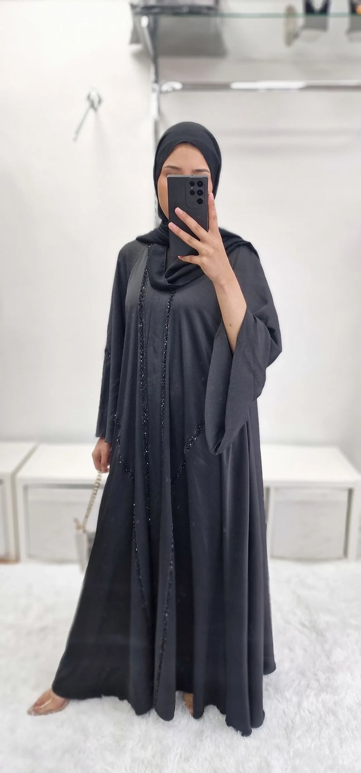 Crafted from premium korean nidha, the ‘khadija’ Double nidha Abaya offers both luxurious style and functionality. The long, non-slippery hijab ensures a comfortable fit, while the exquisite handwork adds an exclusive touch. With its non-see through design, this abaya is perfect for any occasion. Long Khimar With Dabka Detailing, Modest Dabka Abaya For Eid, Abaya Black, Streetwear Shop, Abaya Dress, Luxury Dress, Kaftan Dress, Shop Sweatshirts, Jeans For Sale