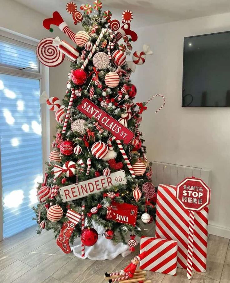 a christmas tree decorated with candy canes and candies