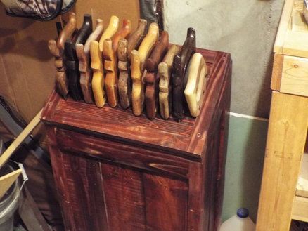 a wooden box filled with lots of different types of sausages