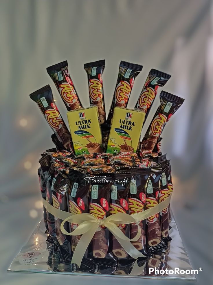 a cake with chocolates and candies on it