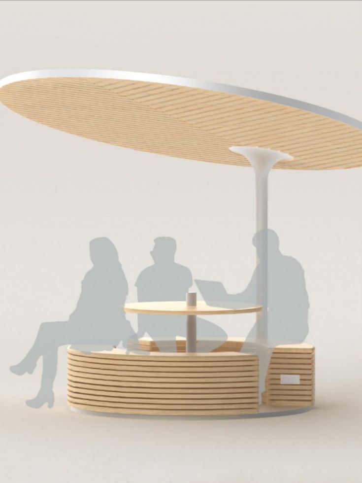 two people are sitting at a table under a large white umbrella that is shaped like a boat